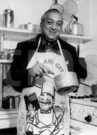 Maharaja of Baroda Pratapsinhrao Gaekwar as a chef cooking in his kitchen in his England home in 1957 (Baroda)