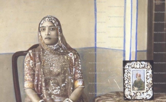 Rani Anoop Kanwar - daughter of Maharaja Bhoom Pal Singhji of Karauli Rajasthan: Photo taken with a picture of her husband Maharaj Man Singhji Jaswantgarh Idar.