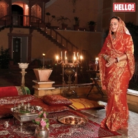 HH Maharani Rohini Kumari of Karauli stands before a traditional royal settee all set up for the Diwali pooja