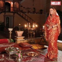 HH Maharani Rohini Kumari of Karauli stands before a traditional royal settee all set up for the Diwali pooja (Karauli)