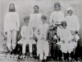 Maharaj Nahar Singh Ji with his children Rajkumar Jagmal Singh Ji (behind him), Rajkumar Narain Singh Ji (left) Rajkumar Prithvi Singh Ji (right). Unidentified family member seated near Nahar Singh Ji