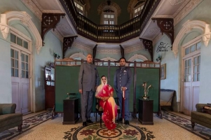 Maharaj Kalika Kumar Sinh of Sanjeli with his wife Rani Giriraj Kumari and their son at the durbar hall of Pushp Nivas, Sanjeli state (Sanjeli)