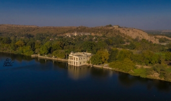 The lake palace Shri Joraver Vilas in Santrampur with the Raj Mahal and the Hawa Mahal in the background, Sant state.