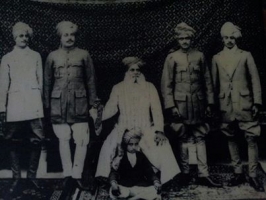 Sohangarh family, sitting on chair Th. Sohan Singh ji  with his 4 sons and grandson Balwant Singh sitting on carpet (Sohangarh)