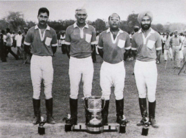 Shriji Arvind Singh Mewar and others with a polo trophy
