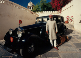 Shriji Arvind Singh Mewar with his Great Dane Rustom beside his 1934 Rolls-Royce Phantom II